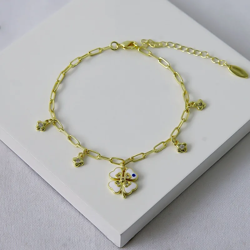 PULSEIRA ELOS CARTIER FLORES C/ZIRCÔNIAS E TREVO RESINADO